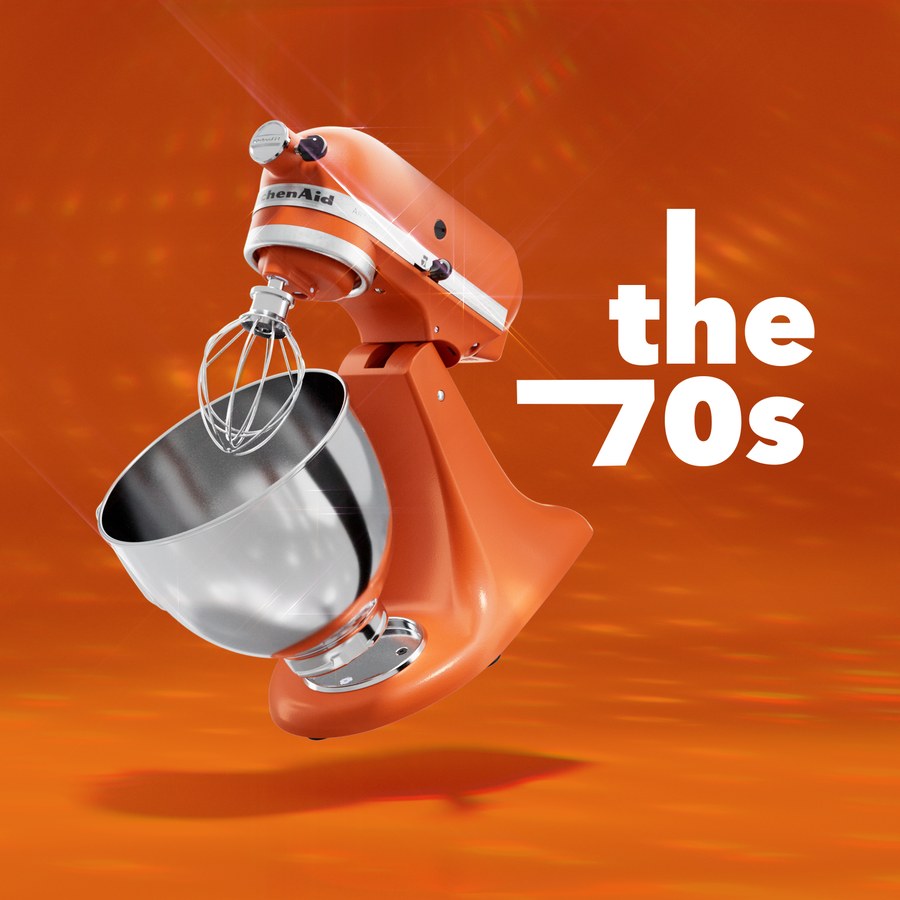 An orange mixer and whisk under the words the 70s