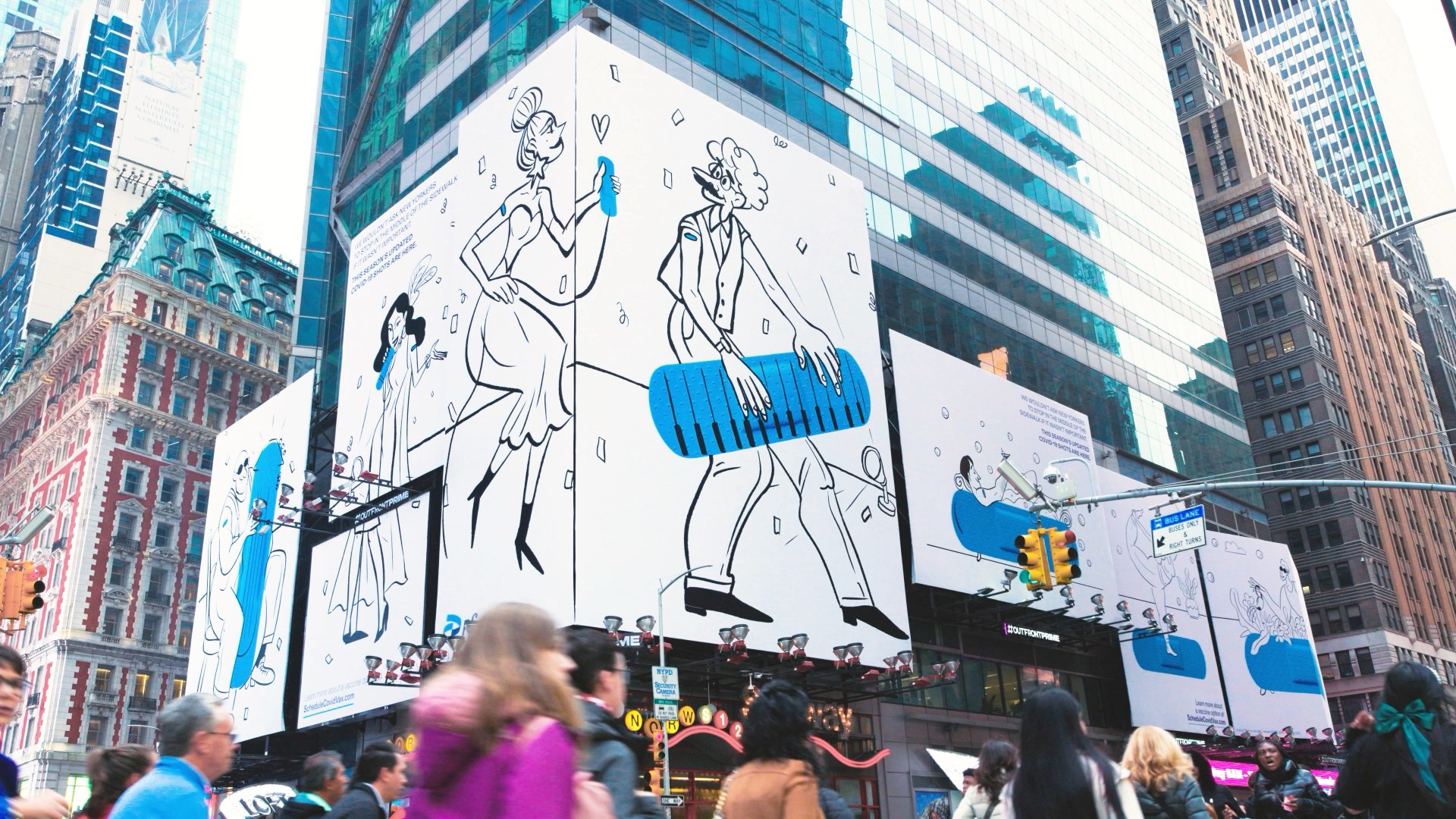 A Pfizer Doodles billboard wrapping a Times Square building by day