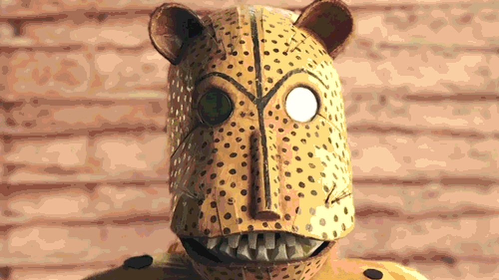A hand-crafted spotted jaguar mask from Apple Meu Bloco na Rua